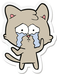 Obraz na płótnie Canvas sticker of a cartoon crying cat