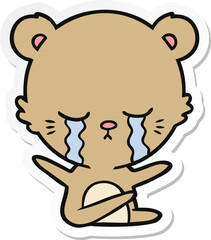 sticker of a crying cartoon bear