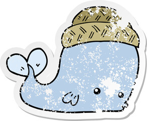 distressed sticker of a cartoon whale wearing hat