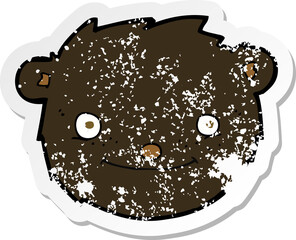 retro distressed sticker of a cartoon black bear head