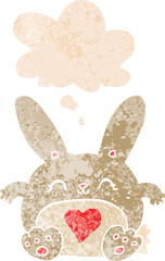 cute cartoon rabbit with love heart and thought bubble in retro textured style