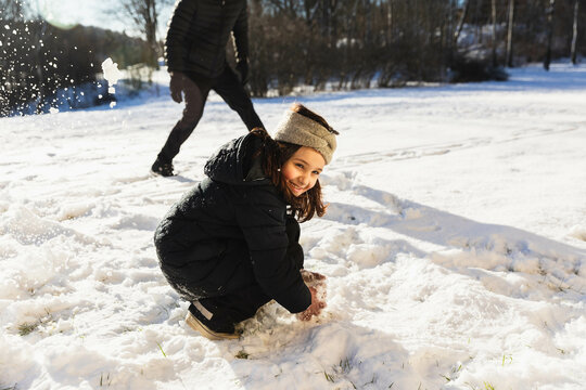 Happy kid playing in the snow
