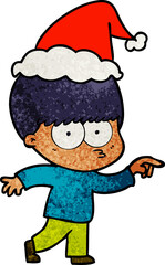 nervous textured cartoon of a boy wearing santa hat