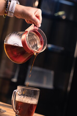 Professional barista preparing coffee. Young woman making coffee. Alternative ways of brewing coffee. Coffee shop concept