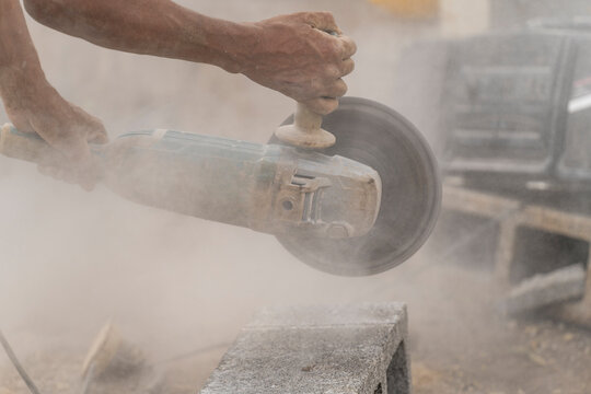 Unrecognizable man using a cutting machine