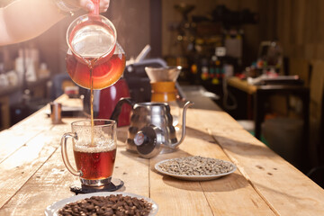 Professional barista preparing coffee. Young woman making coffee. Alternative ways of brewing coffee. Coffee shop concept