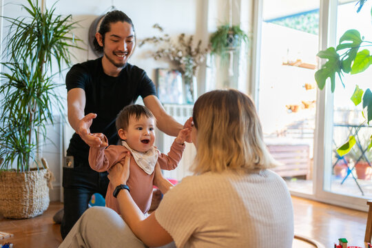 Multiracial Asian Family Spends Quality Time Together At Home.