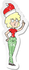 retro distressed sticker of a cartoon woman wearing santa hat
