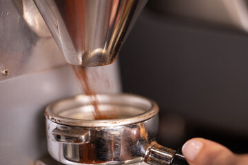 Professional barista preparing coffee. Young woman making coffee. Alternative ways of brewing coffee. Coffee shop concept