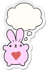 Obraz na płótnie Canvas cute cartoon rabbit with love heart and thought bubble as a printed sticker