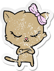distressed sticker of a cute cartoon cat with bow