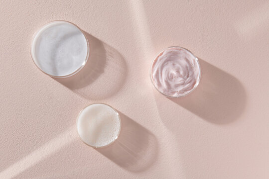 Glass petri dish with transparent pure serum for skin care