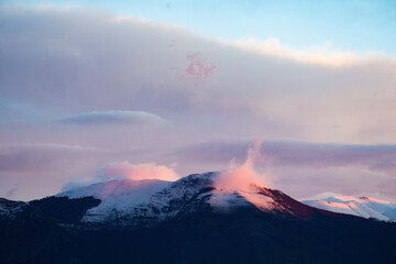 Stunning view of snowcapped mountains during a beautiful sunset.