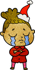 textured cartoon of a crying woman wearing santa hat