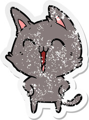 distressed sticker of a happy cartoon cat meowing