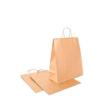 Craft bags on a white background. Place for text and logo. The concept of packaging, packaging, eco-packaging of products, food, own style and brand. High quality photo