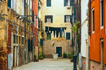 Fototapeta premium venice street with water during the golden hour