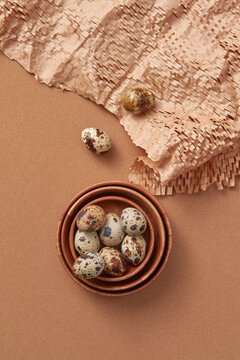 Quail eggs in set of handmade porcelain bowls.
