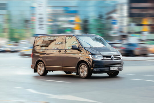 Black van Volkswagen Multivan T6 riding on the city streets