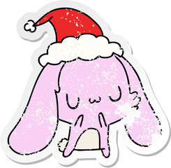 christmas distressed sticker cartoon of kawaii rabbit