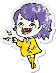 distressed sticker of a cartoon laughing vampire girl