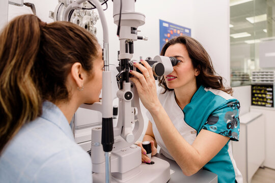 Female optometrist checking patients eyesight