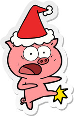 sticker cartoon of a pig shouting and kicking wearing santa hat