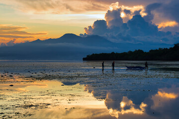 Fisherman in sunset in the island of Siquijor in Philipines. Siquijor island in Filipines- Sunset light in linely island.  Filipinas landscape with golden light. Golden hour. 