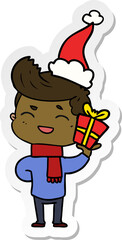 sticker cartoon of a man laughing wearing santa hat