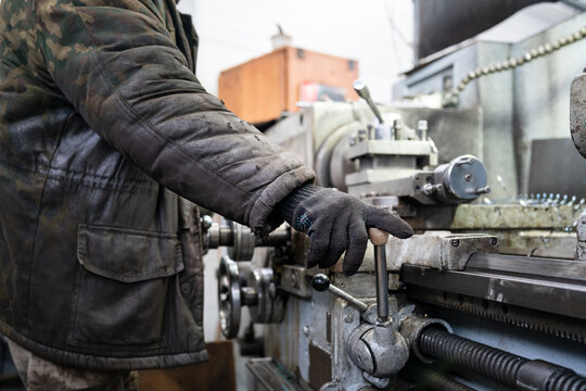 hands of factory machine worker 