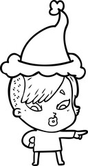 Fototapeta premium line drawing of a surprised girl pointing wearing santa hat