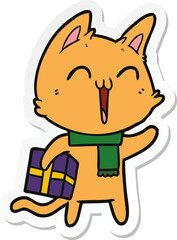 sticker of a happy cartoon cat with christmas gift