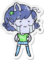 distressed sticker of a cartoon crying alien girl