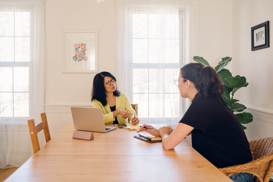 woman asking questions during an interview with  a young woman 