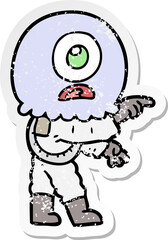 distressed sticker of a cartoon cyclops alien spaceman pointing