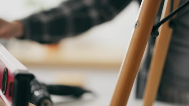 Installation, Business owners Carefully Measures with a ruler Home interior, General angle Active young parent Assembles designer furniture In his apartment, Furniture working inventory
