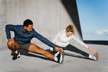 Sporty Couple Exercising And Being Active Together Outside