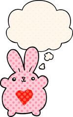 Obraz premium cute cartoon rabbit with love heart and thought bubble in comic book style