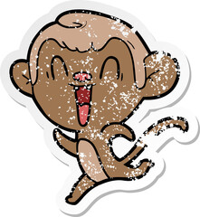 distressed sticker of a cartoon laughing monkey