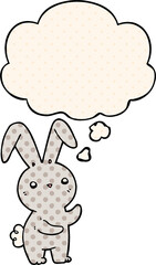 cute cartoon rabbit and thought bubble in comic book style