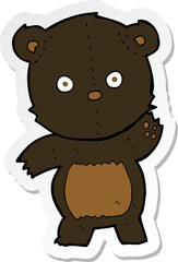 sticker of a cute cartoon black bear