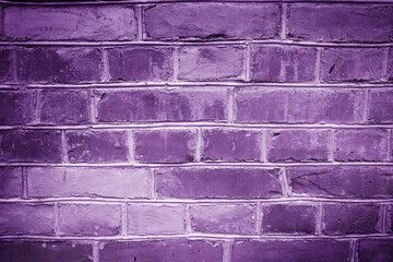 Classic purple brick wall texture close up.