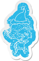cartoon distressed sticker of a happy woman wearing santa hat