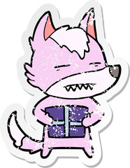 distressed sticker of a cartoon wolf with a gift