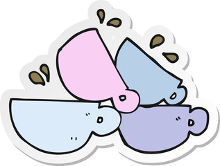 sticker of a cartoon coffee cups