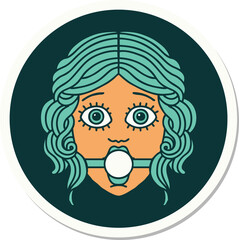 tattoo style sticker of female face with ball gag