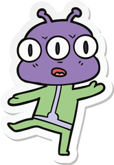 sticker of a cartoon three eyed alien