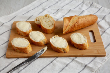 Homemade Bread and Butter on a bamboo board, side view.