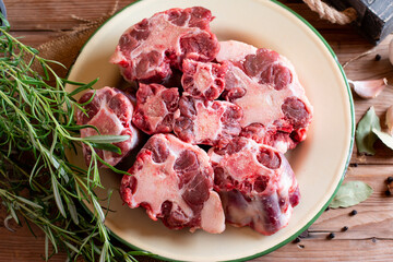 Raw beef Oxtail cut Meat on cutting board. Top view.