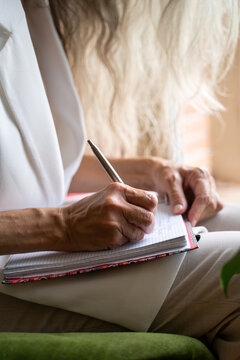 mature woman writing close-up